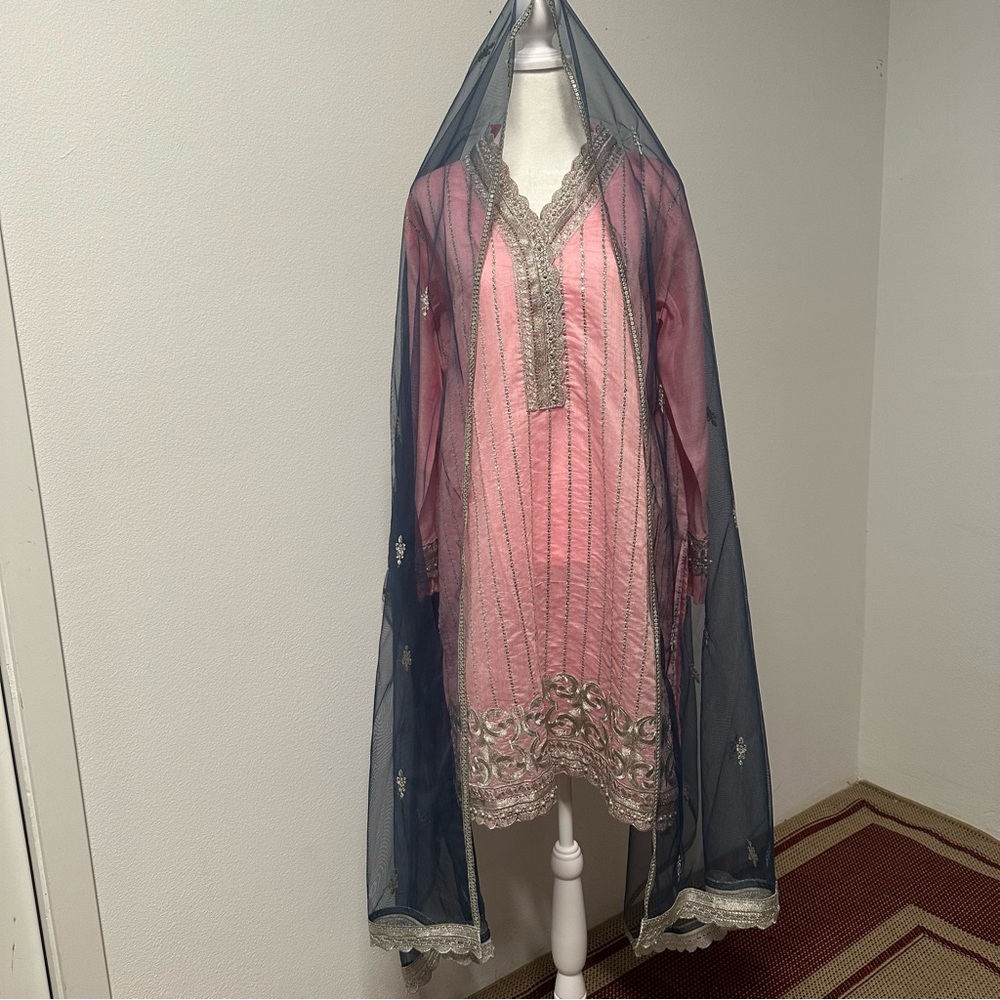 Three-piece formal salwar kameez in a soft blush pink with silver embellishment